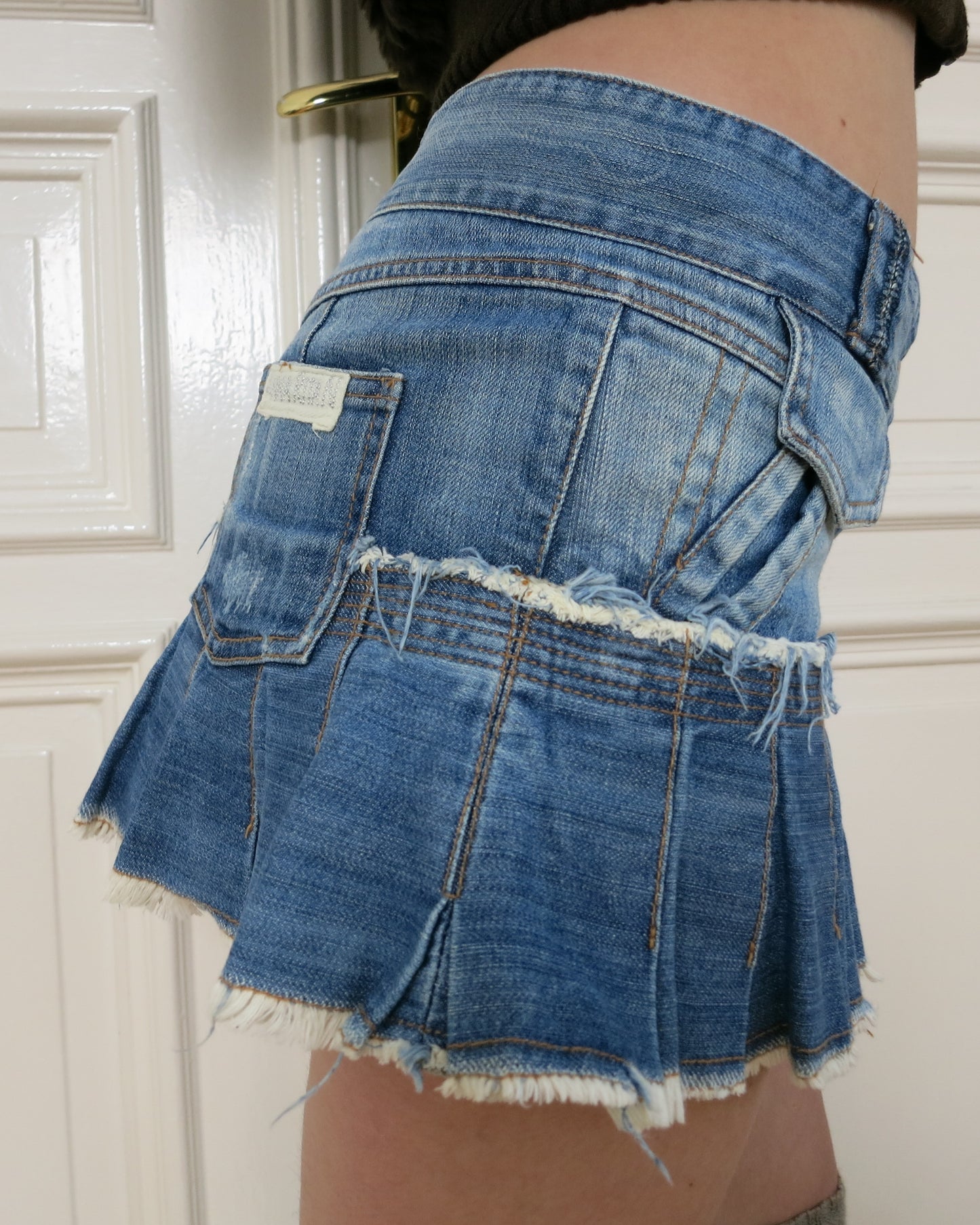 Pleated denim miniskirt