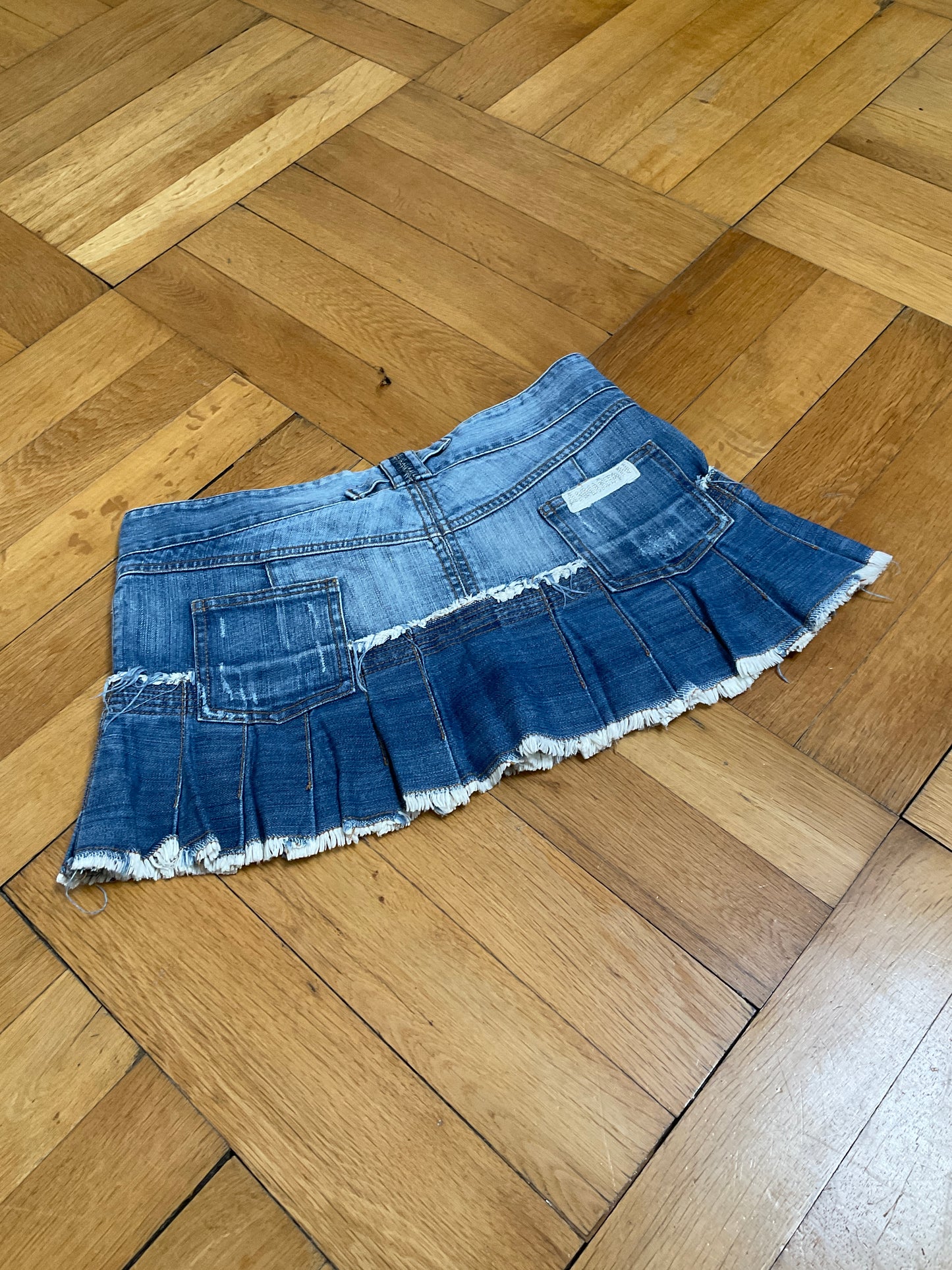 Pleated denim miniskirt