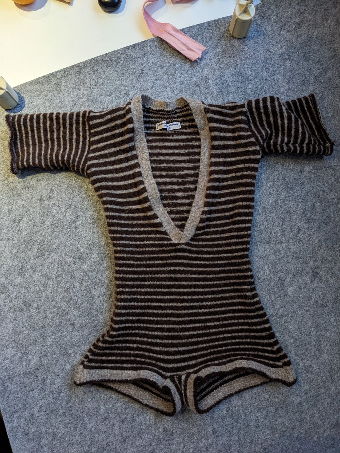 eithne padraigin ni bhraonain striped v-neck onesie